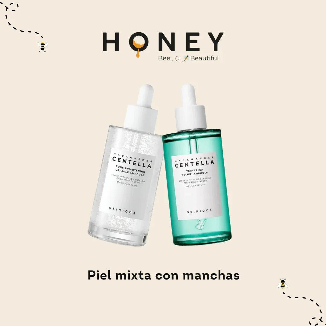 Dos botellas de suero facial Skin1004 Madagascar Centella para piel mixta con manchas con diseño de abejas y fondo beige